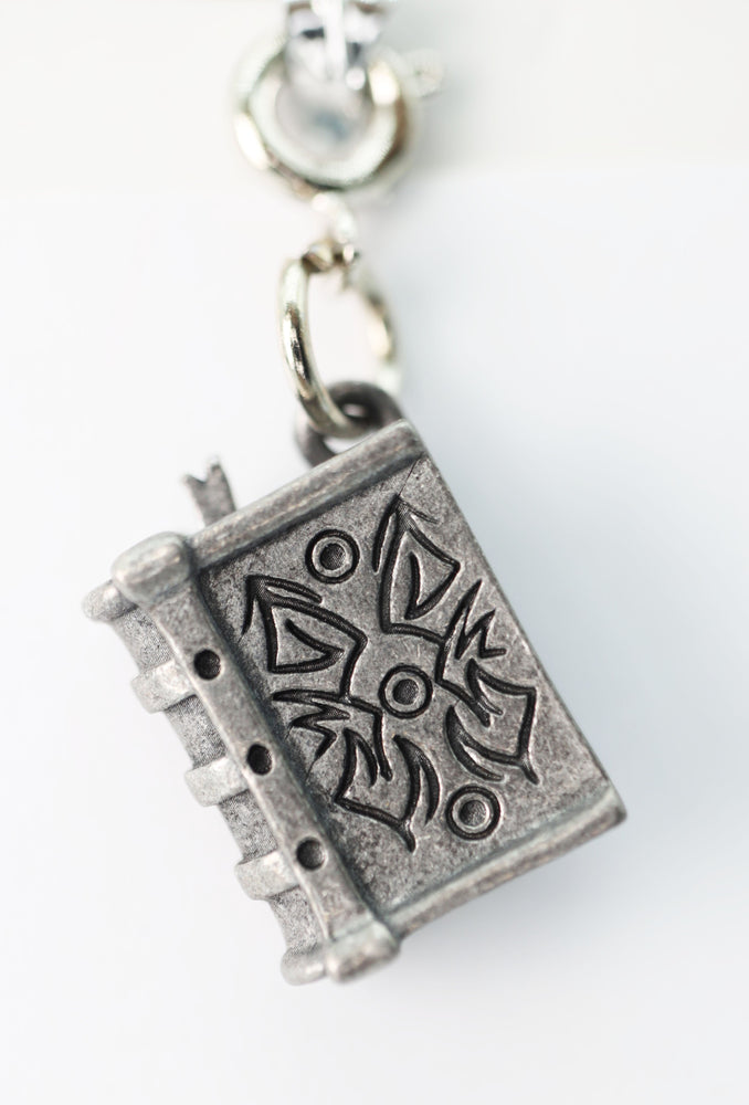 Traveler's Trinkets - Tome Charm